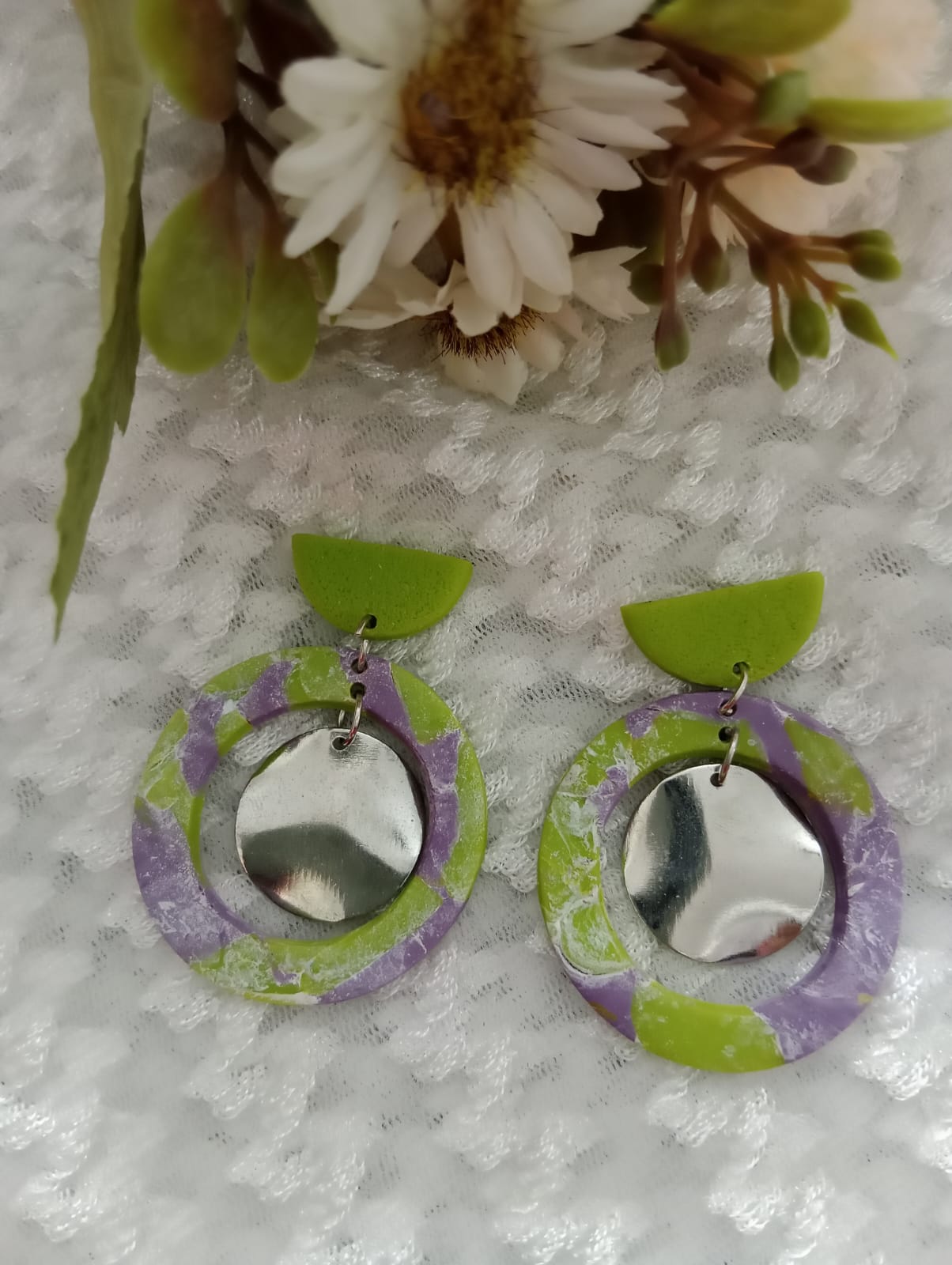 "Colorful Circular Earrings with Floral Background"