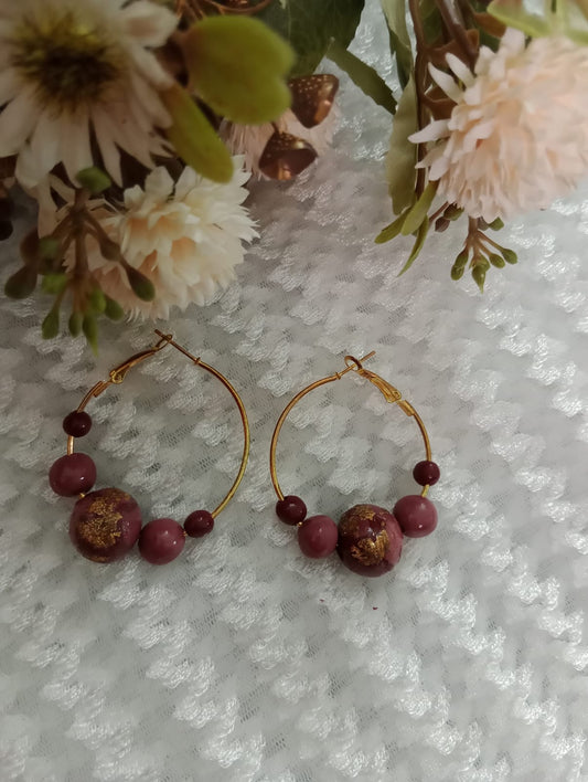 "Elegant Gold Hoop Earrings with Maroon Beads"